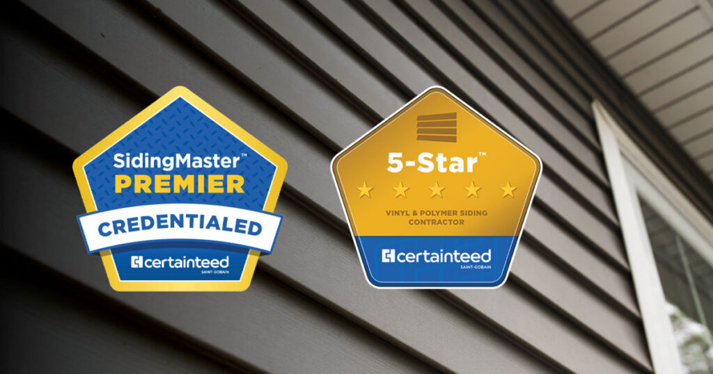 A closeup of vinyl house siding with 2 professional badges added